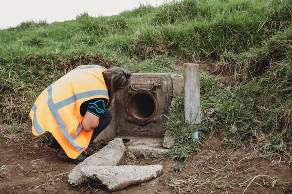 Regional Council staff member inspecting a flood gate.