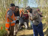 People gathered to look at sediment